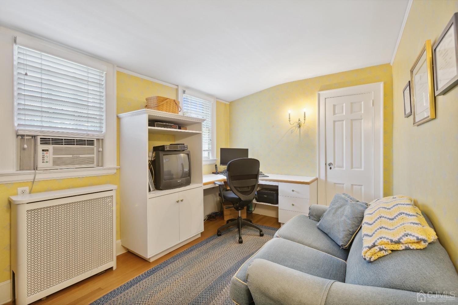 32 Oak Hills Road Edison, NJ 08820 - Photo 38 of 54 a living room with furniture and a flat screen tv