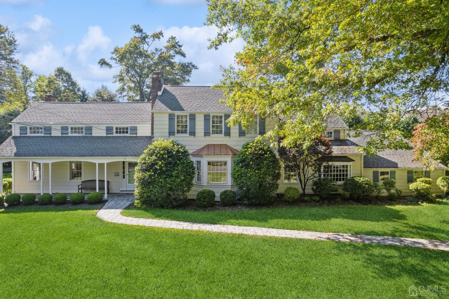 32 Oak Hills Road Edison, NJ 08820 - Photo 42 of 54 a front view of a house with a garden