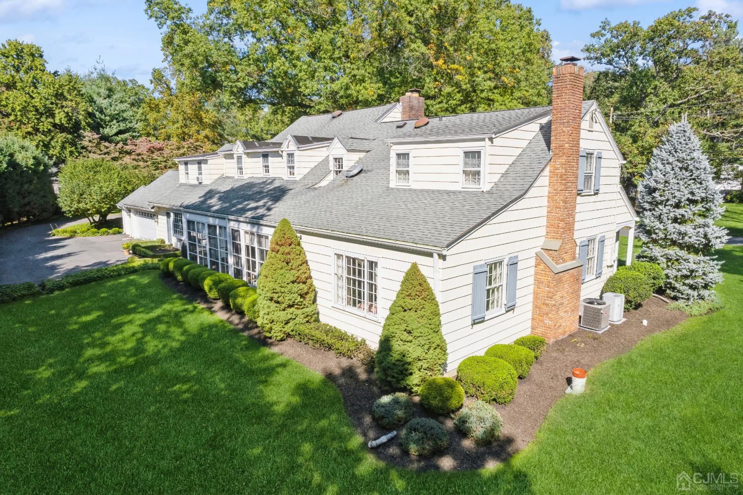 32 Oak Hills Road Edison, NJ 08820 - Photo 45 of 54 a aerial view of a house with a yard and potted plants