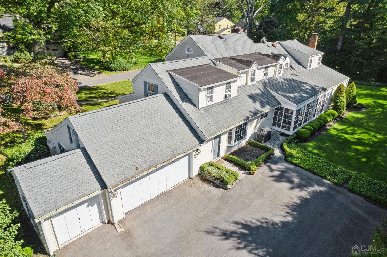 32 Oak Hills Road Edison, NJ 08820 - Photo 46 of 54 an aerial view of a house with a yard and balcony
