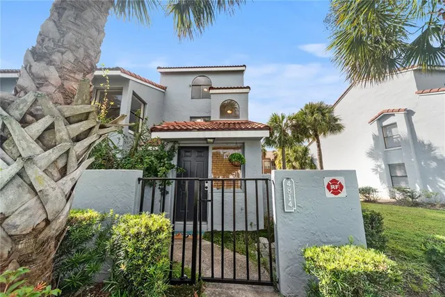 a front view of house with yard and outdoor seating