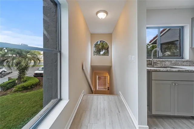 an aerial view of a house with a yard and outdoor seating