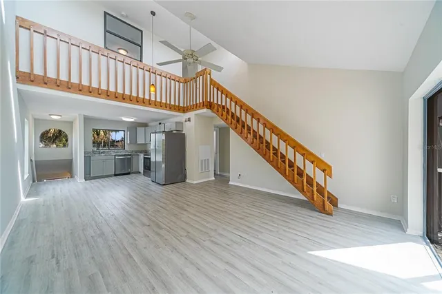 a view of an entryway with wooden floor