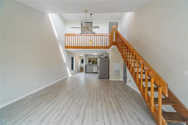 a view of an entryway with wooden floor