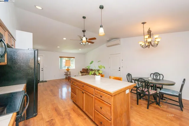 a kitchen with sink and refrigerator