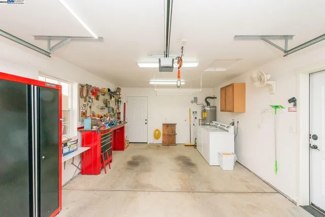 a view of a utility room with closet and windows