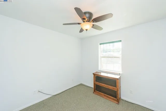 a room with a desk and a window