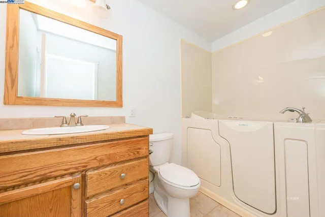 a house that has a tree in front of it