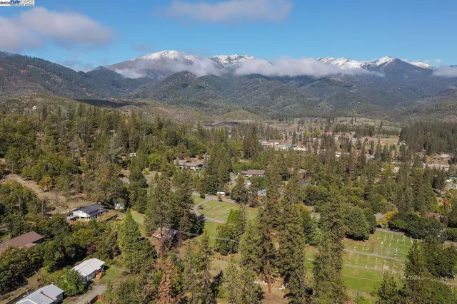a balcony with table and chairs