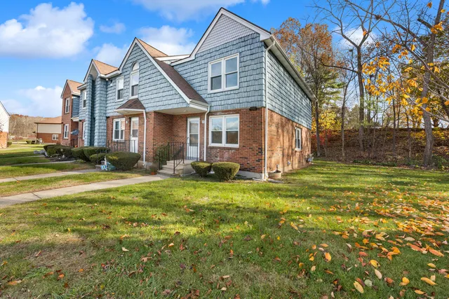 a front view of a house with a yard