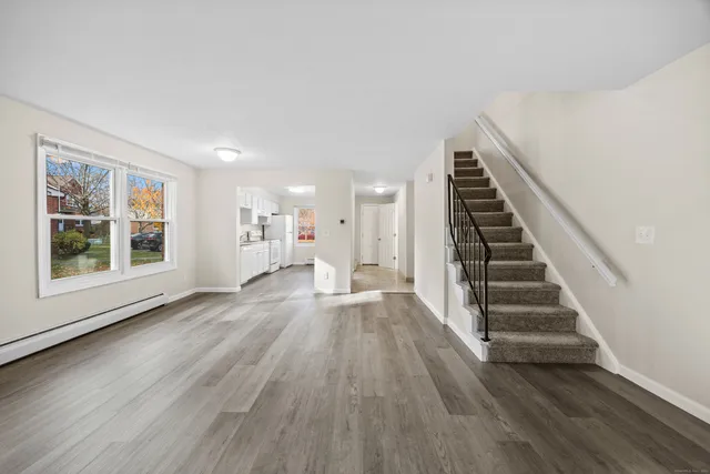 a view of wooden floor and windows in a room