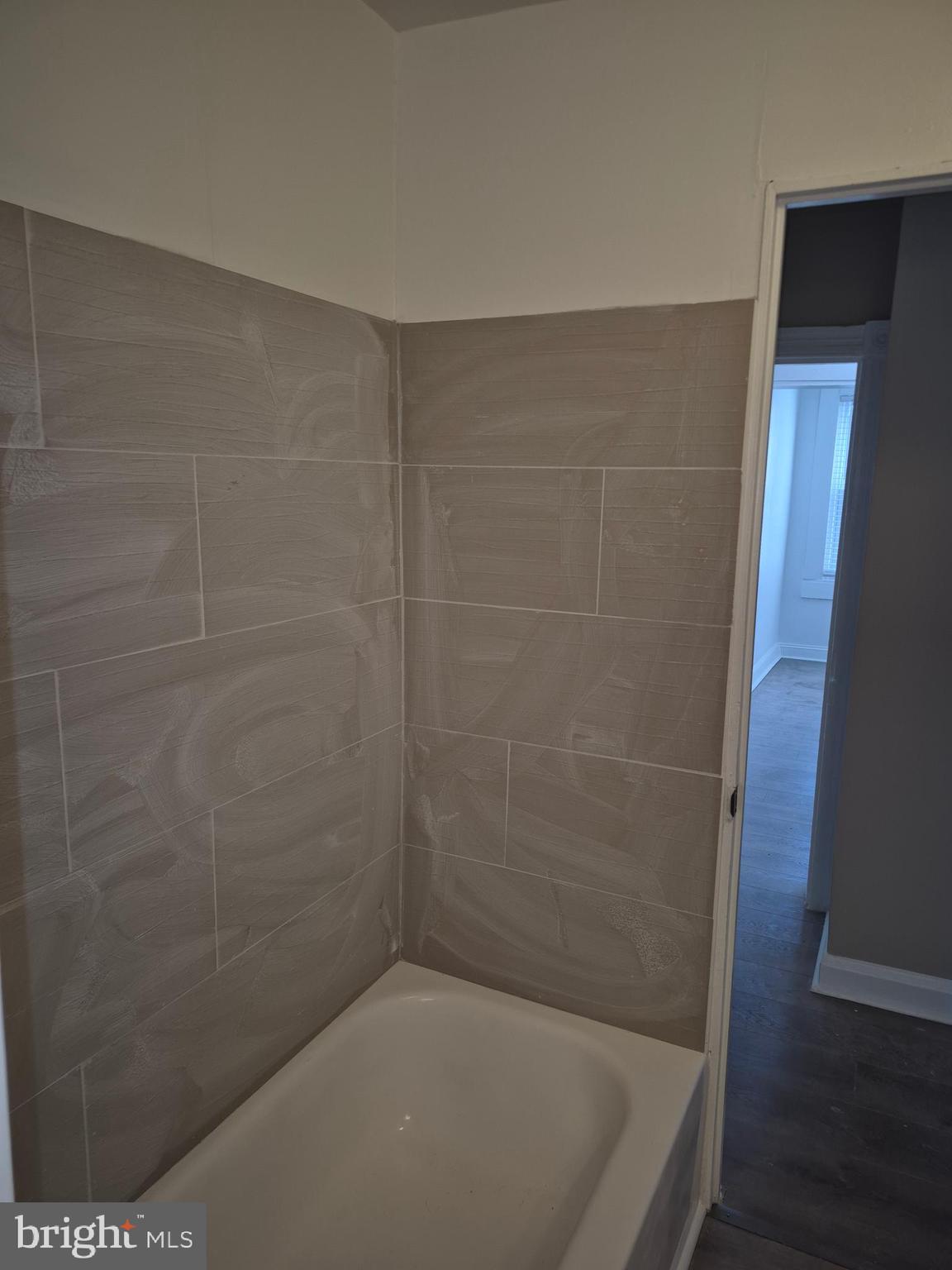 707 North Duncan Street Baltimore, MD 21205 - Photo 15 of 28 a bathroom with a bath tub and a shower