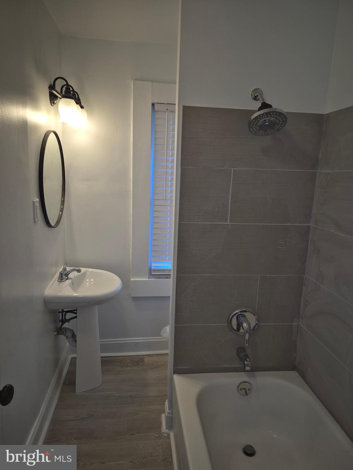 707 North Duncan Street Baltimore, MD 21205 - Photo 16 of 28 a bathroom with a sink a toilet and shower