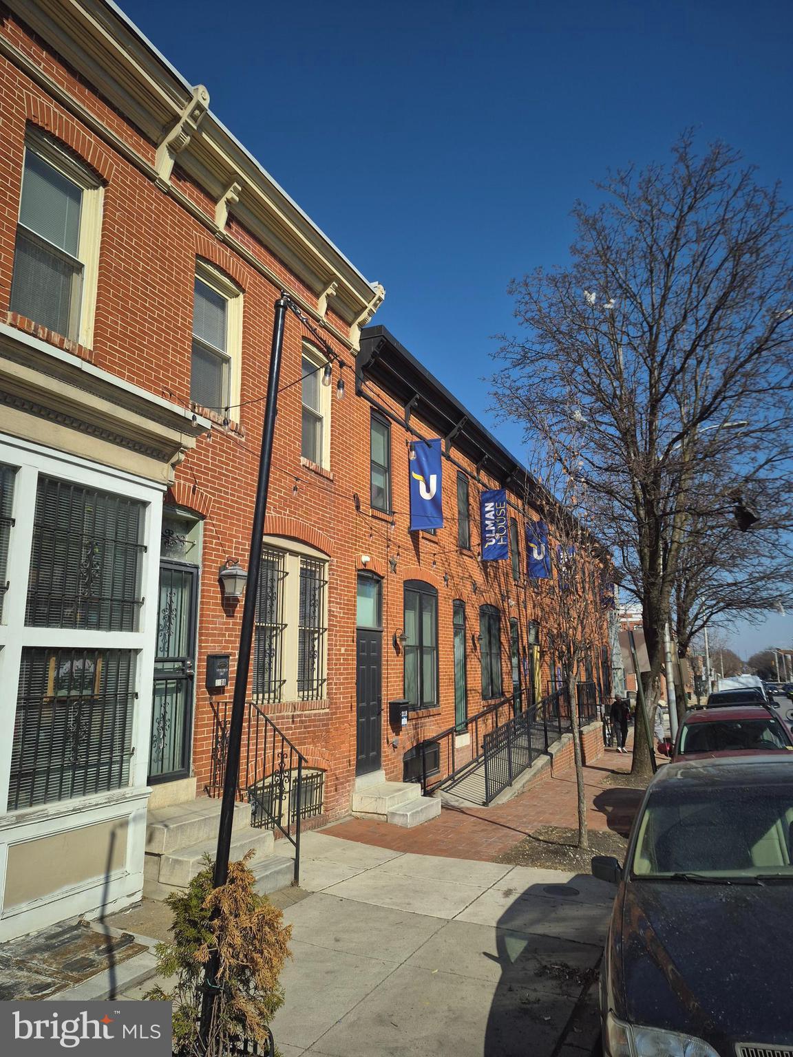 707 North Duncan Street Baltimore, MD 21205 - Photo 26 of 28 a front view of a building with lot of cars