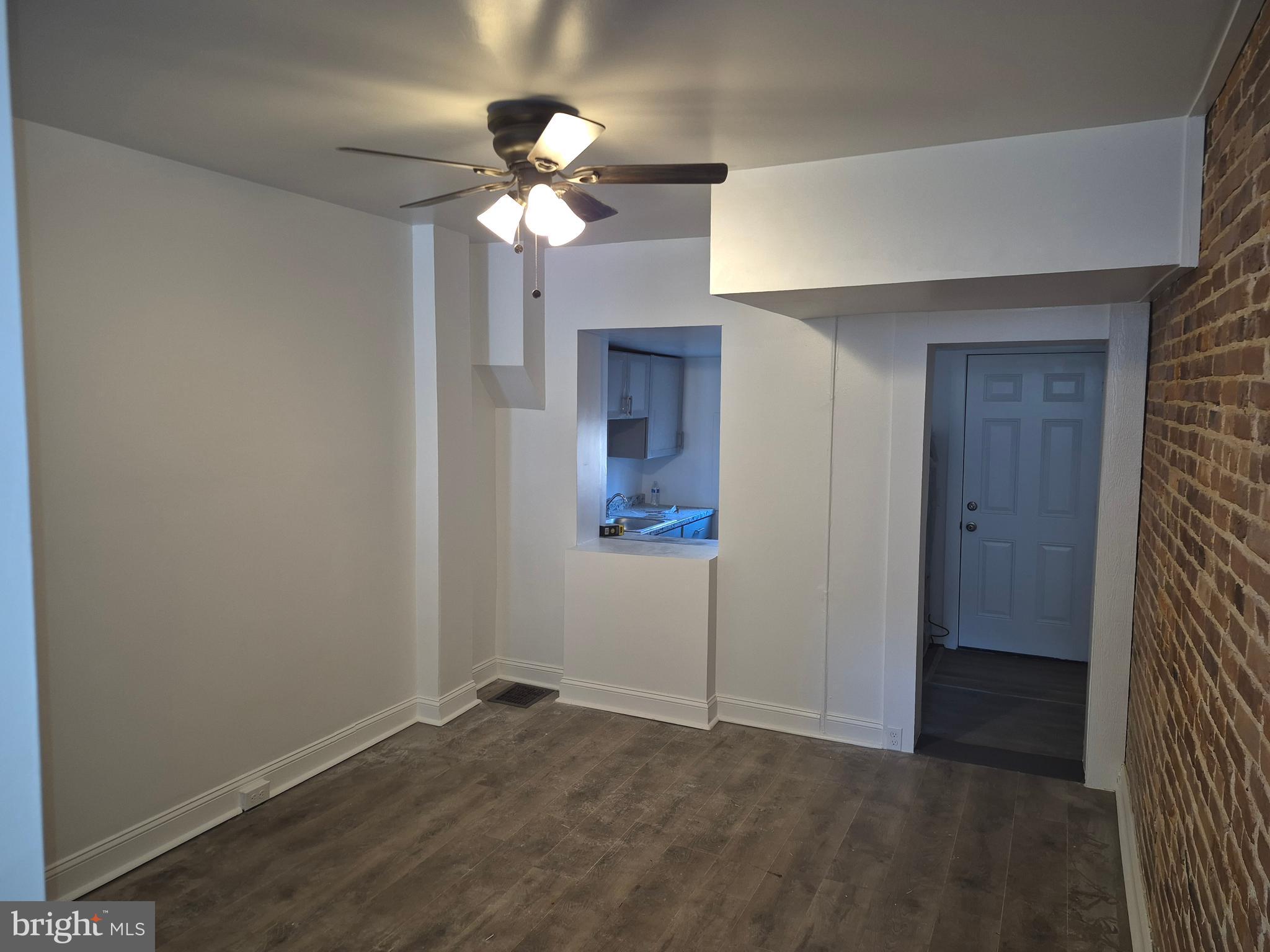 707 North Duncan Street Baltimore, MD 21205 - Photo 8 of 28 wooden floor in an empty room with a mirror