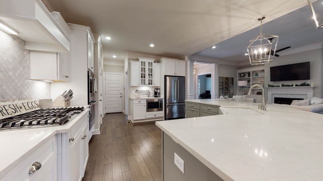 a spacious bathroom with a double vanity sink mirror and a toilet