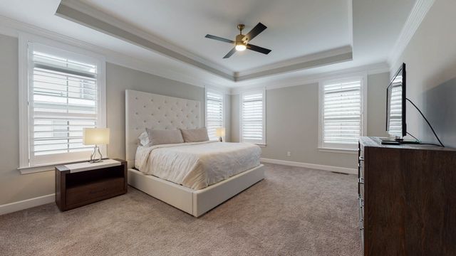 a spacious bathroom with a double vanity sink a mirror and a shower