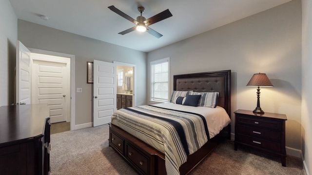 a view of a room with wooden floor and a window