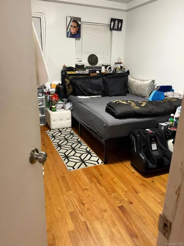a living room with furniture and a mirror
