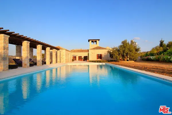 a view of a building with a yard