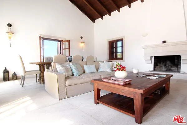a kitchen with stainless steel appliances granite countertop a refrigerator and wooden cabinets