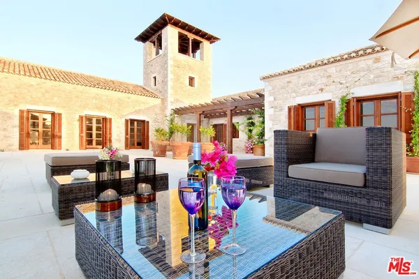 a view of a swimming pool with an outdoor seating