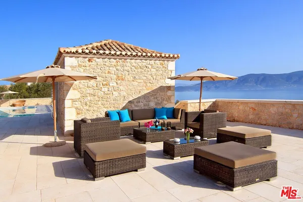 a view of a terrace with furniture