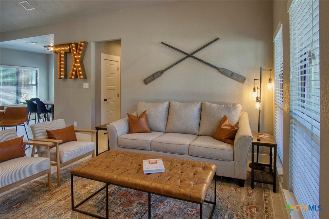 1112 Greenhill Drive Canyon Lake, TX 78133 - Photo 3 of 19 a living room with furniture and wooden floor