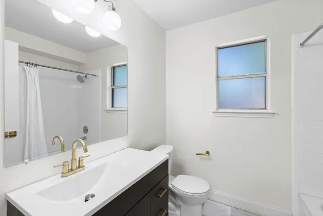 a view of a house with backyard and porch