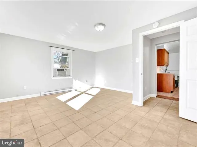 a view of an empty room and window