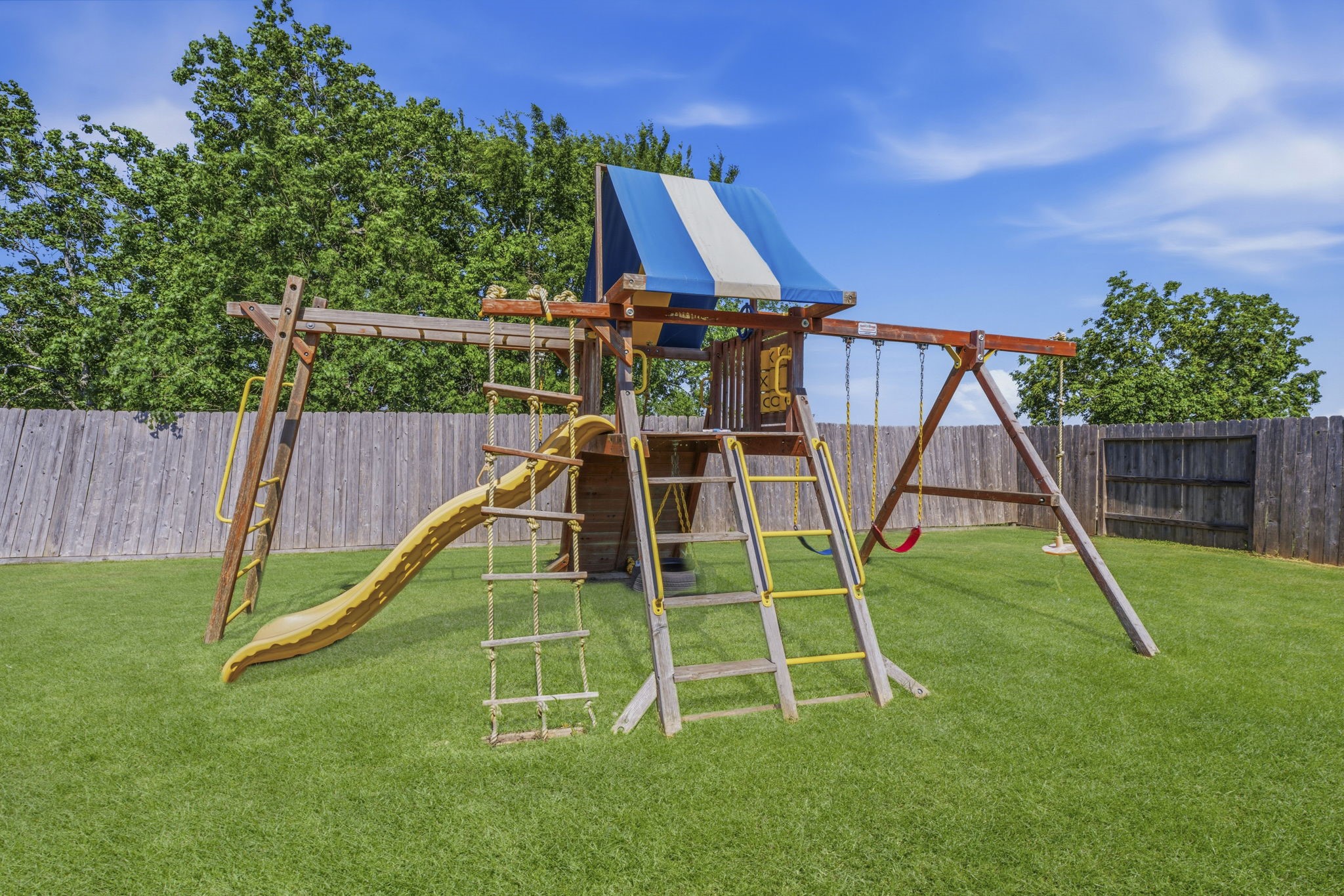2401 Abbot Brk Drive Rosharon, TX 77583 - Photo 43 of 50 Imagine all the fun here on this swing set with slide, swings, rope ladder, and fort