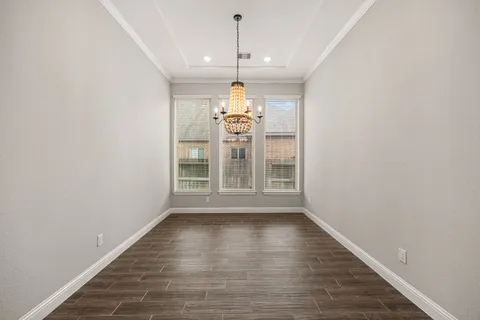 a decorative lighting & window in an empty room