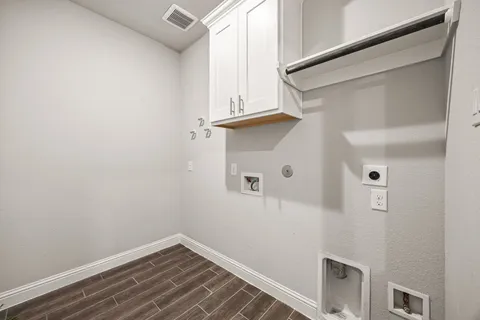 a view of storage and utility room with racks on the wall