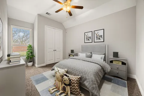 a bed room with a bed and a chandelier