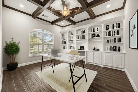 a view of a livingroom with furniture window and wooden floor