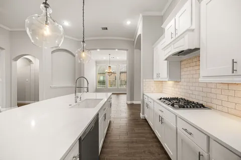 a kitchen with sink and stove