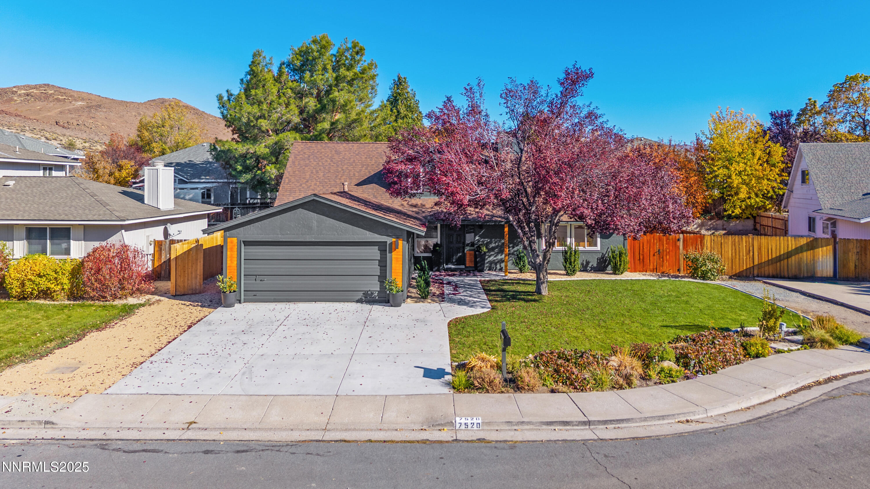 7520 Berryhill Drive Reno, NV 89511 - Photo 1 of 72 a view of a house with a yard and a garage