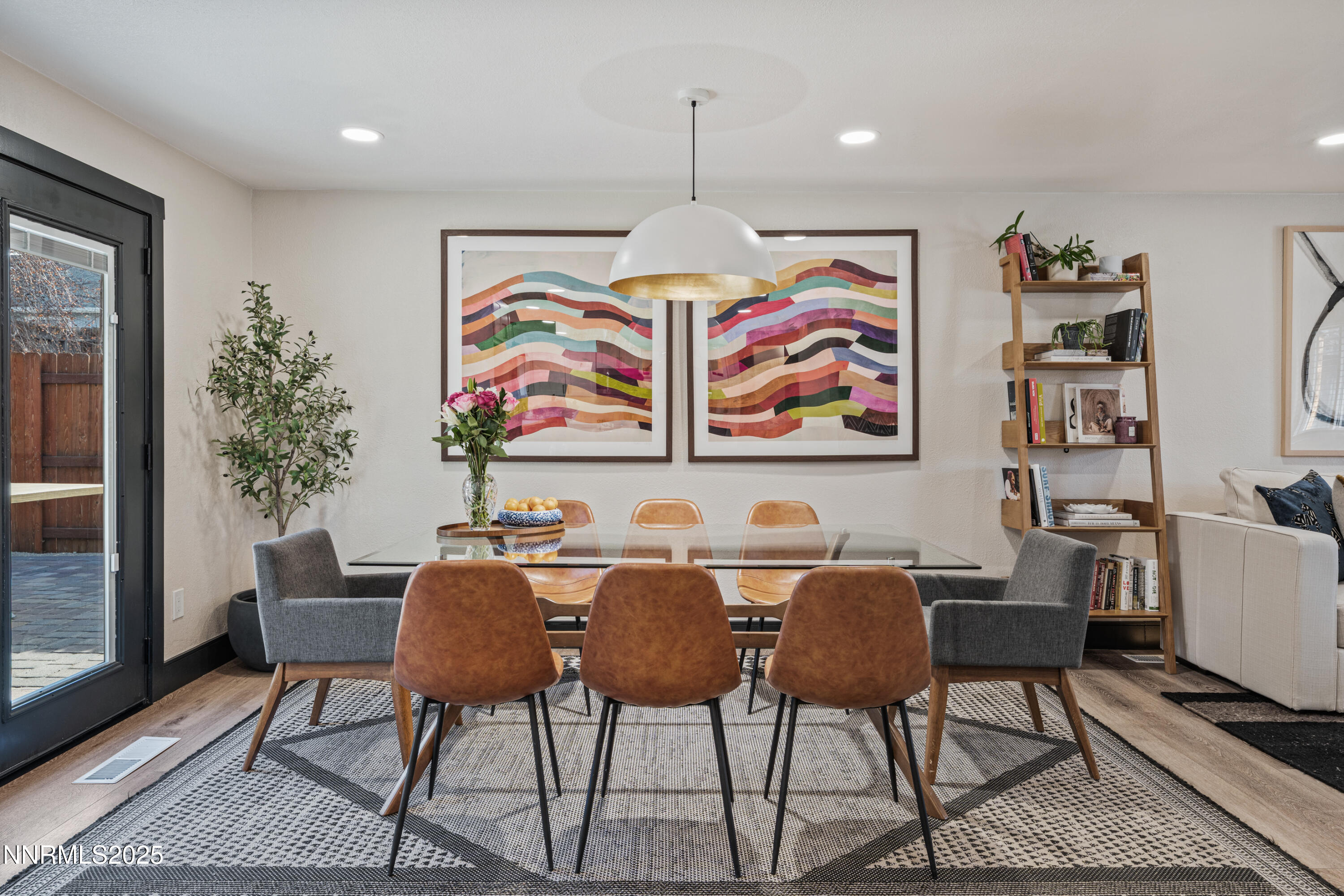 7520 Berryhill Drive Reno, NV 89511 - Photo 16 of 72 a view of a dining room with furniture a rug and wooden floor