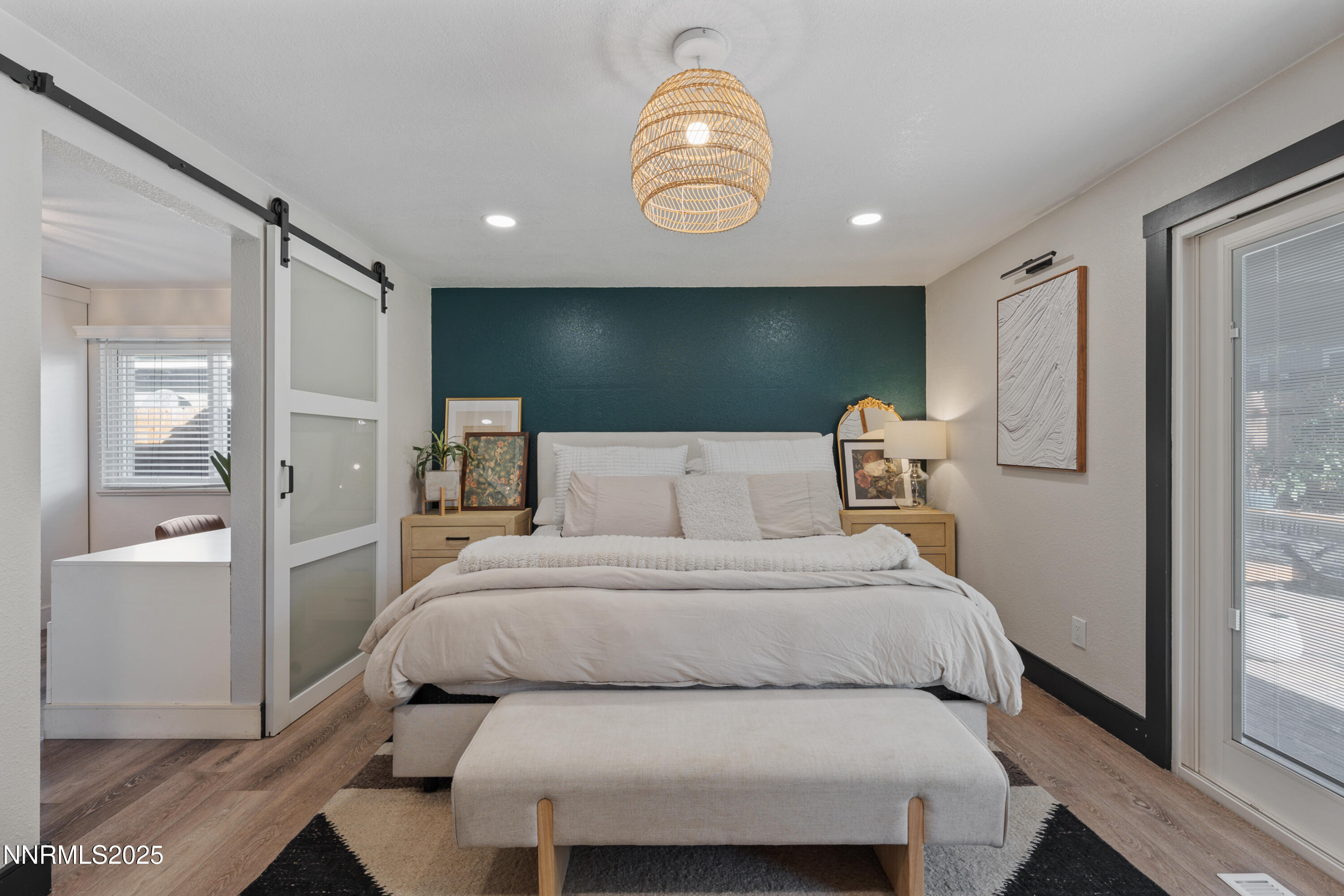 7520 Berryhill Drive Reno, NV 89511 - Photo 29 of 72 a bedroom with a bed and a chandelier