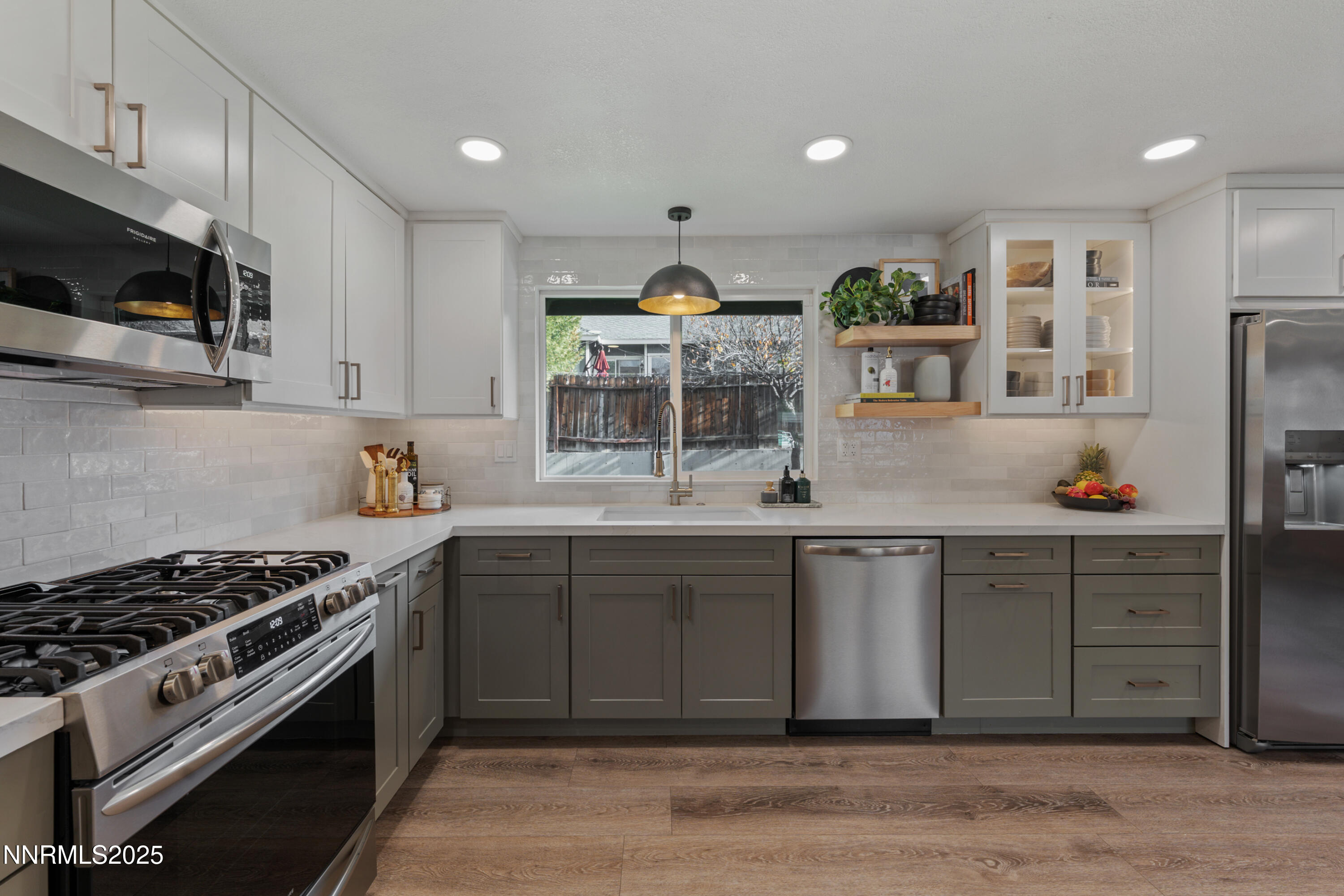 7520 Berryhill Drive Reno, NV 89511 - Photo 3 of 72 a kitchen with stainless steel appliances granite countertop a stove a sink and a microwave