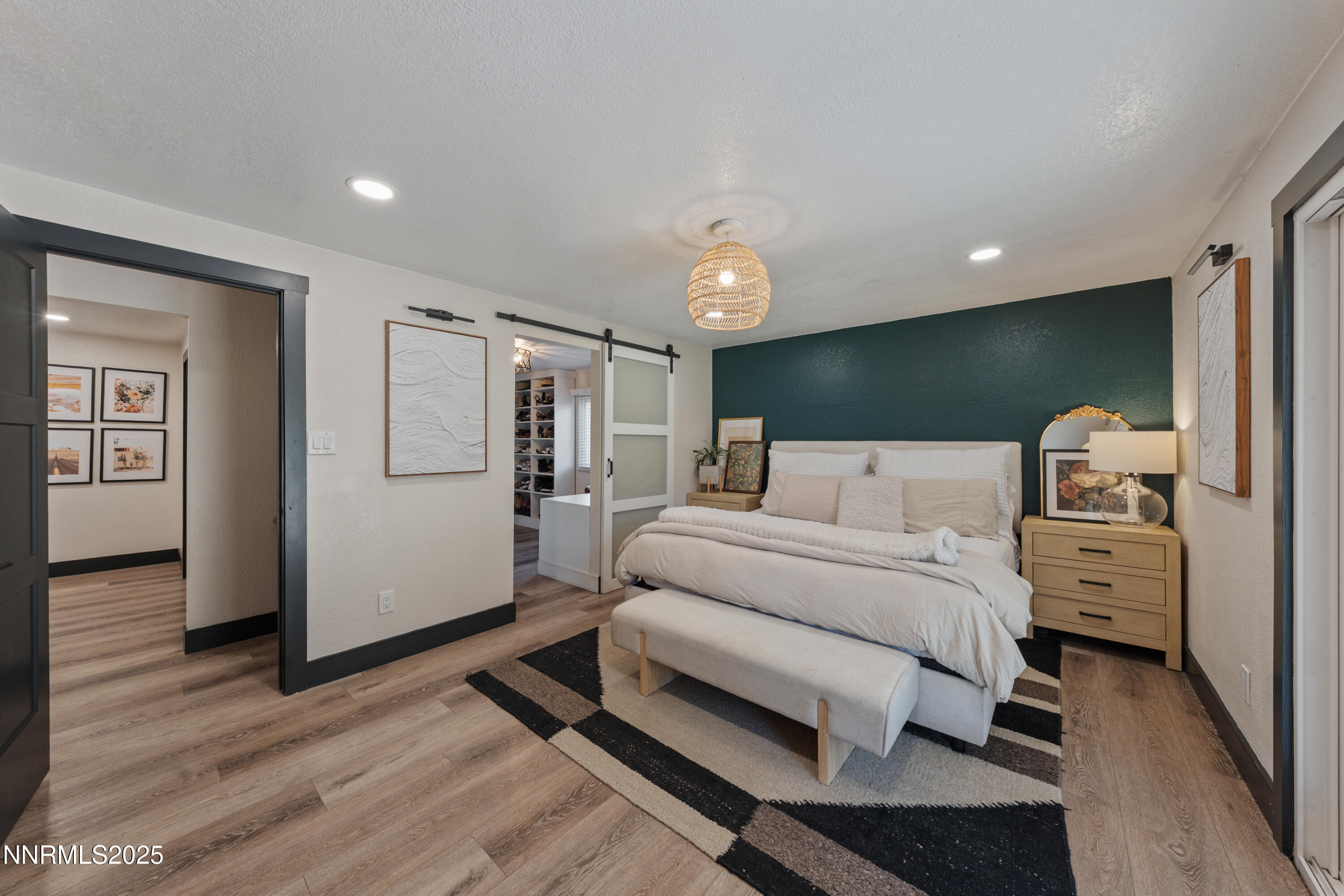7520 Berryhill Drive Reno, NV 89511 - Photo 32 of 72 a spacious bedroom with a bed and wooden floor