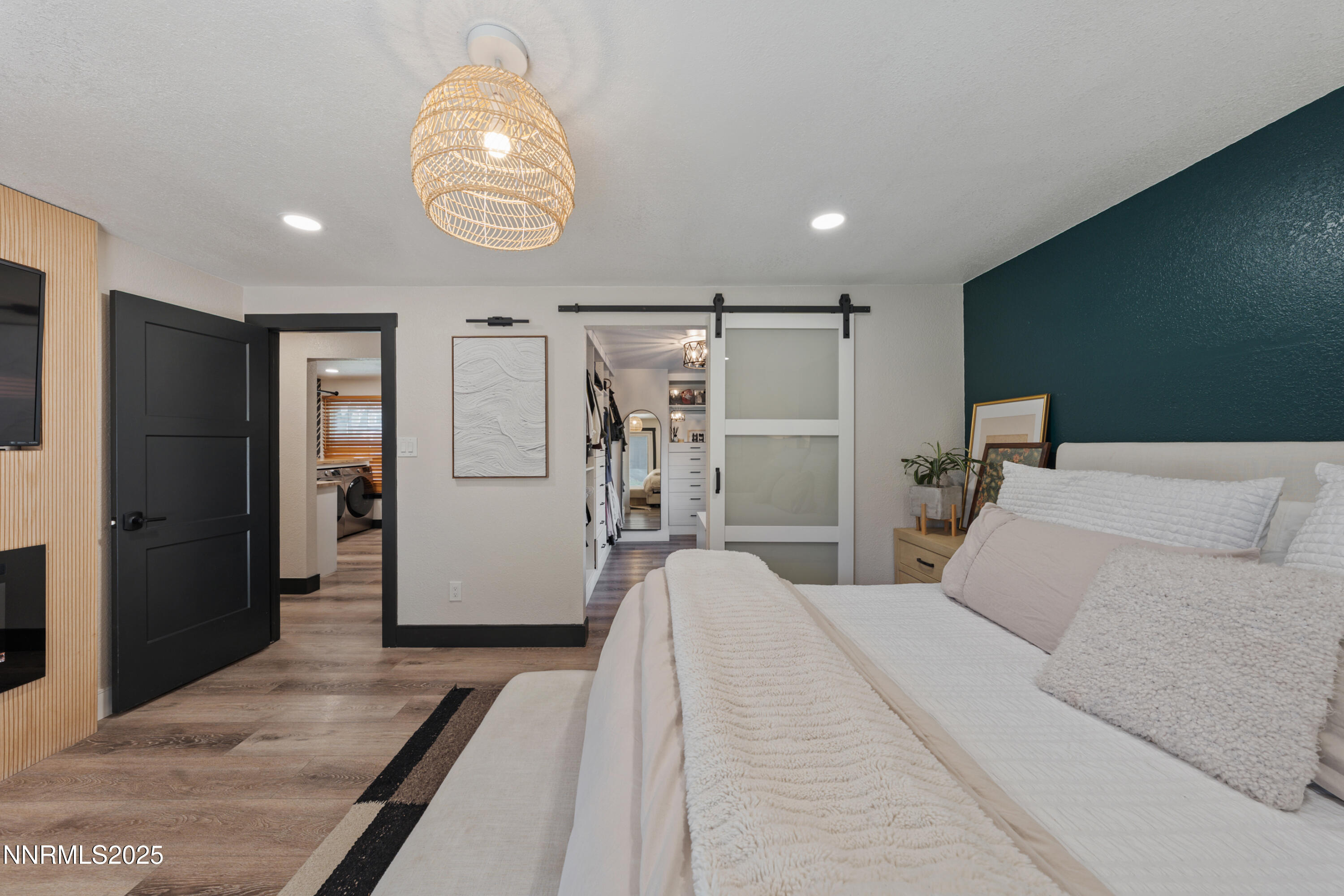 7520 Berryhill Drive Reno, NV 89511 - Photo 33 of 72 a bedroom with a bed and a chandelier