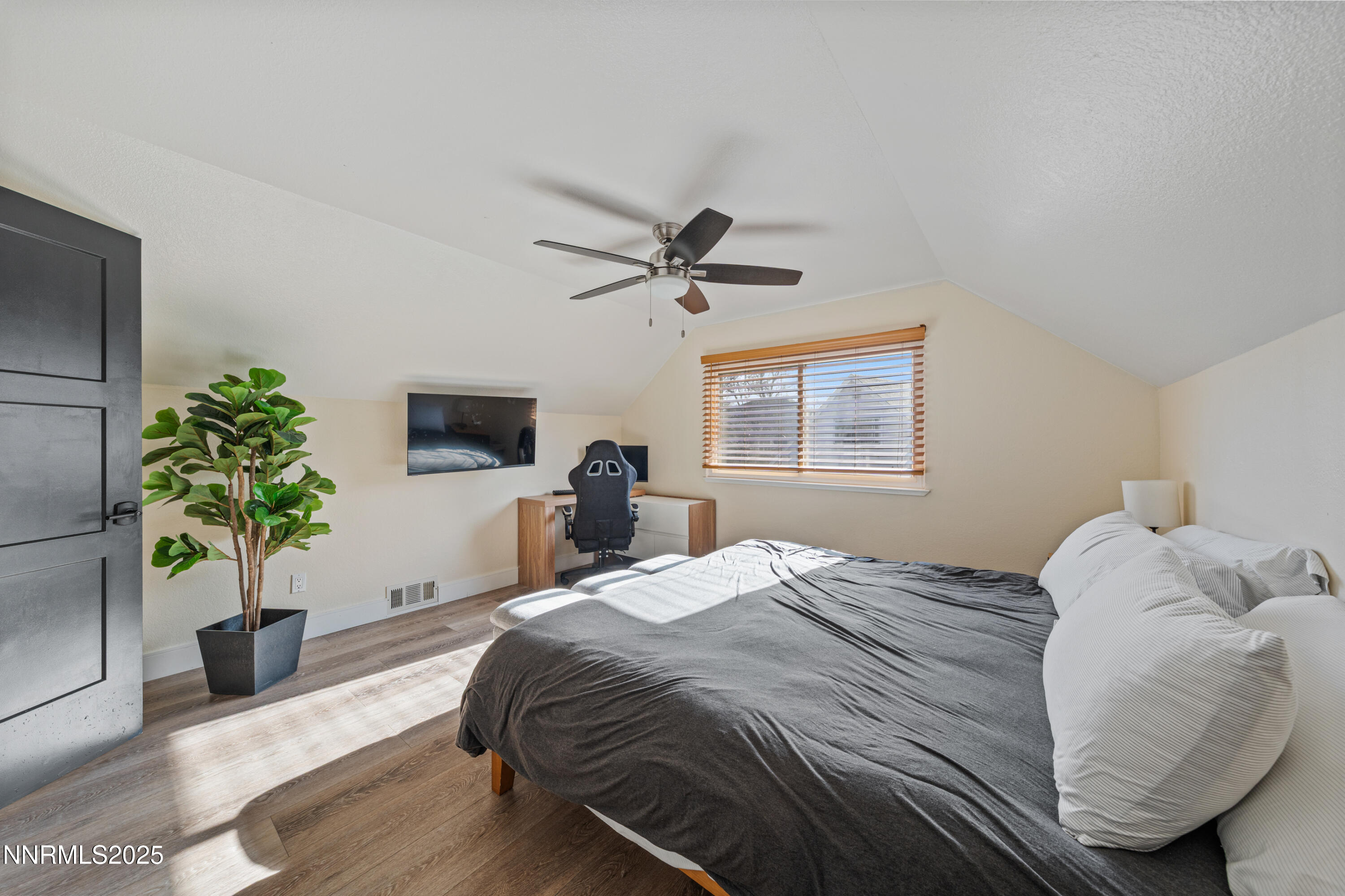 7520 Berryhill Drive Reno, NV 89511 - Photo 43 of 72 a bedroom with a bed potted plant on the dresser and a window