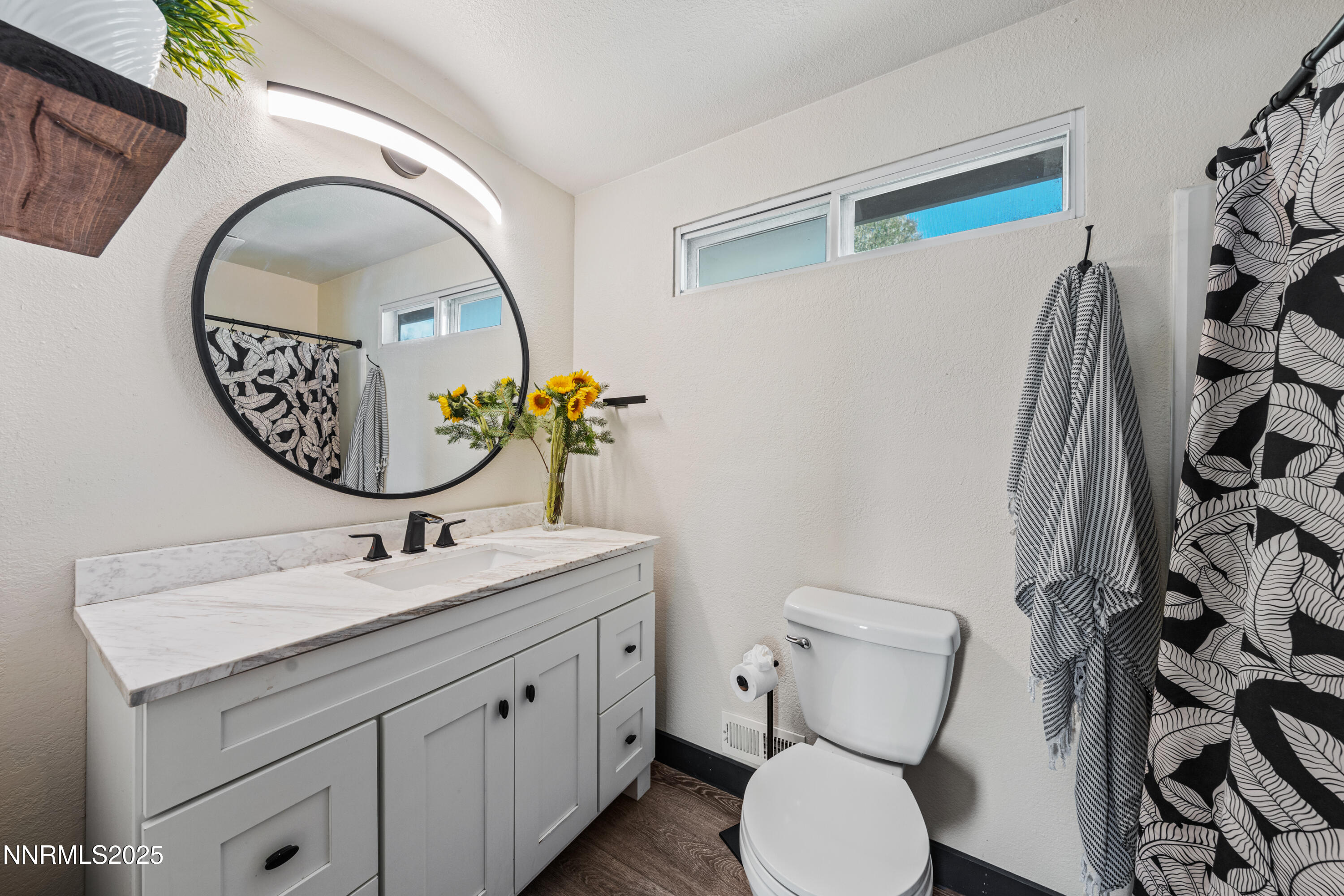 7520 Berryhill Drive Reno, NV 89511 - Photo 48 of 72 a bathroom with a toilet sink and mirror