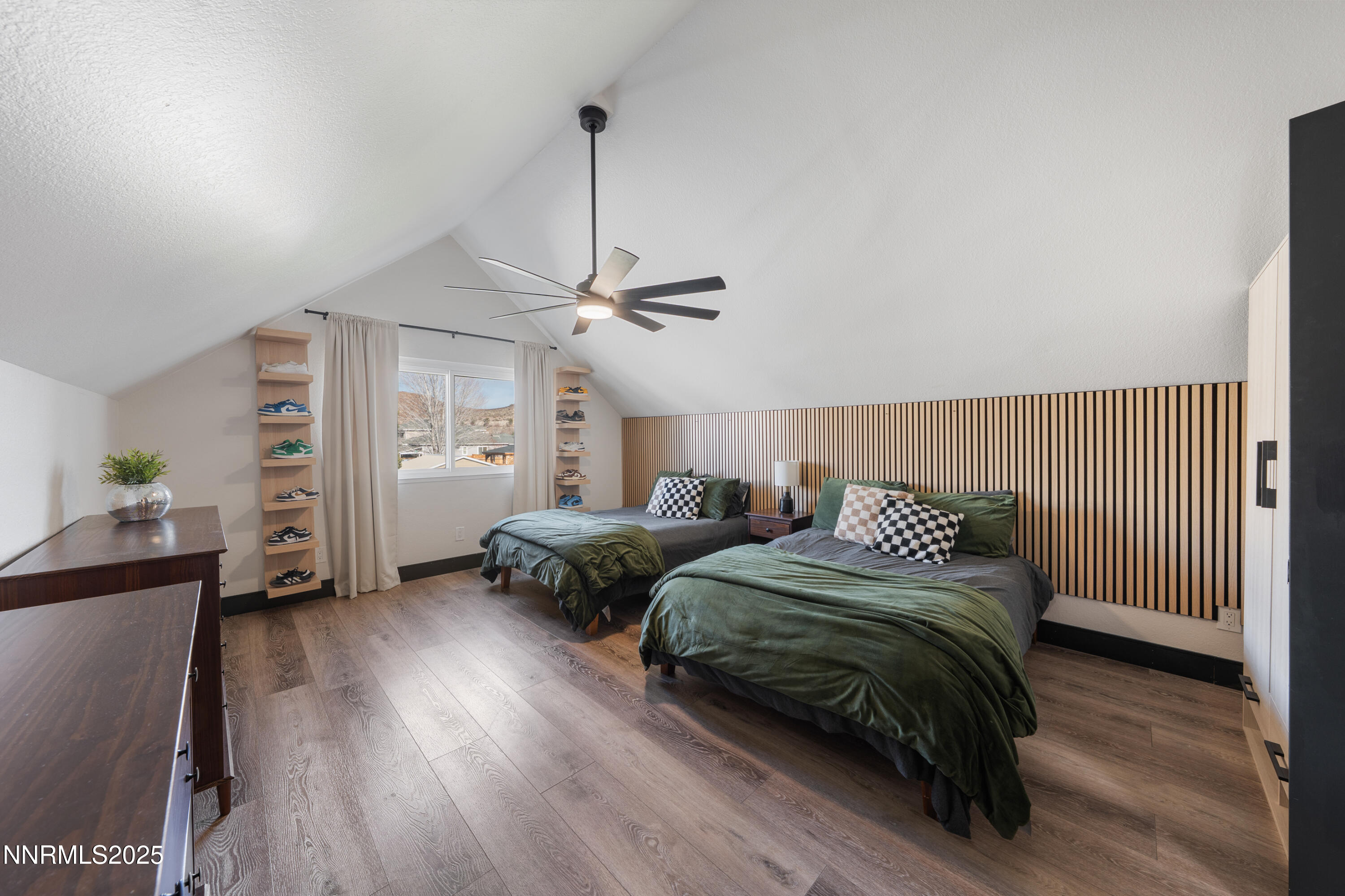 7520 Berryhill Drive Reno, NV 89511 - Photo 52 of 72 a bedroom with two beds and a chandelier