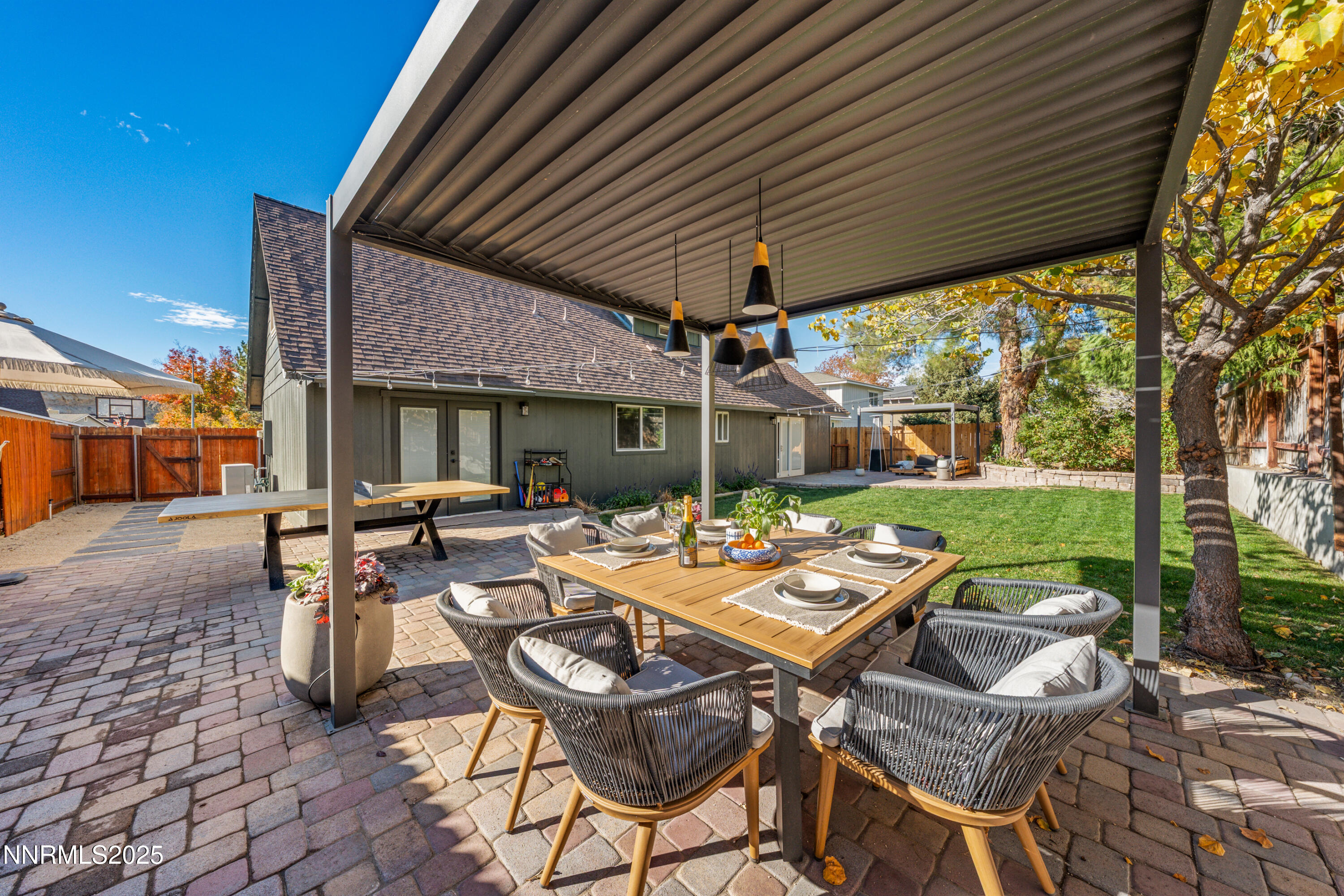7520 Berryhill Drive Reno, NV 89511 - Photo 55 of 72 a view of a patio with a table and chairs under an umbrella