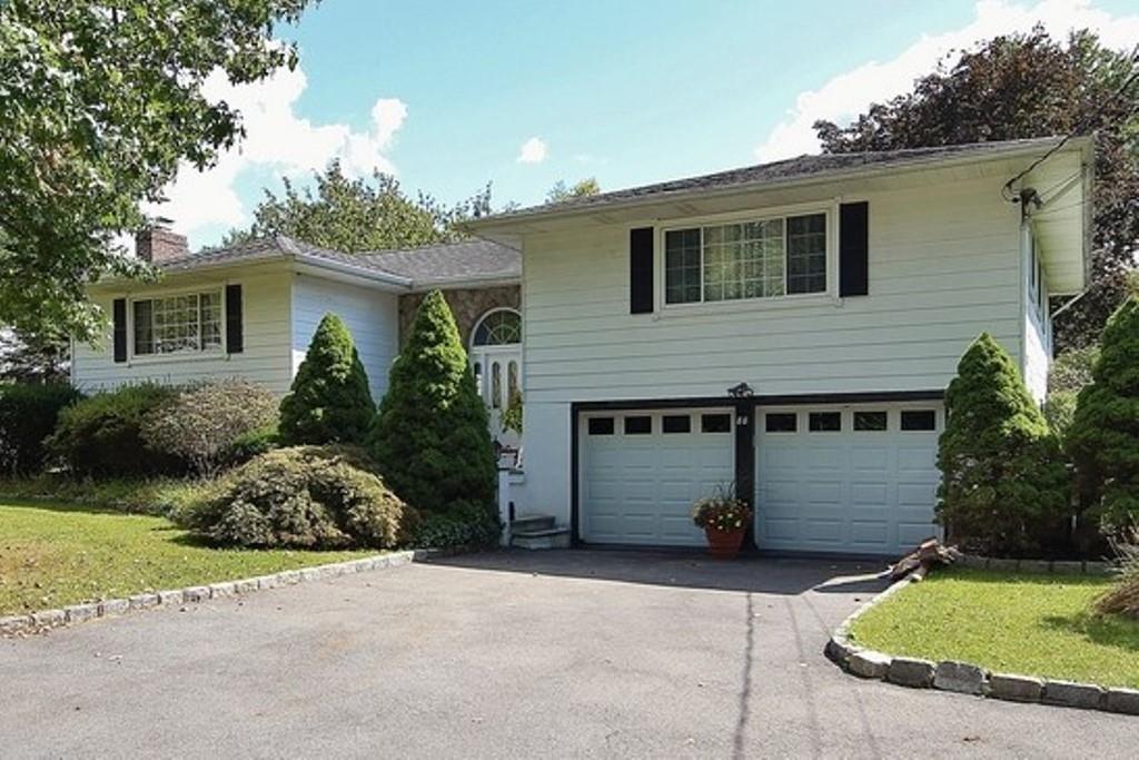 88 Croton Dam Road Ossining, NY 10562 - Photo 1 of 1 a front view of a house with garden