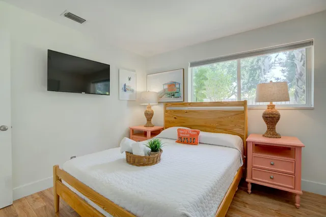 a bedroom with furniture and a window