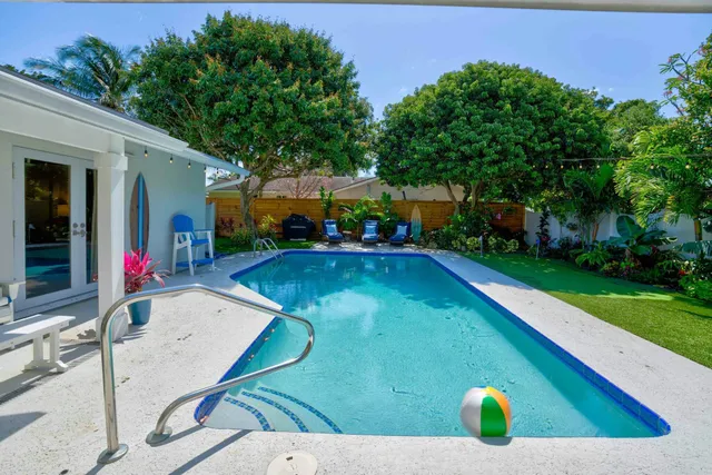 a view of a house with swimming pool