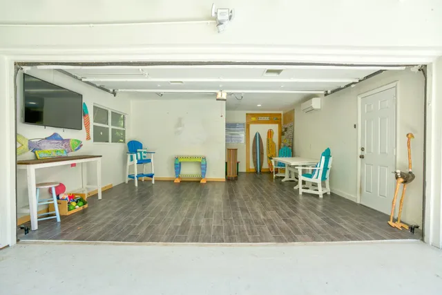 a view of a yard with plants and trees